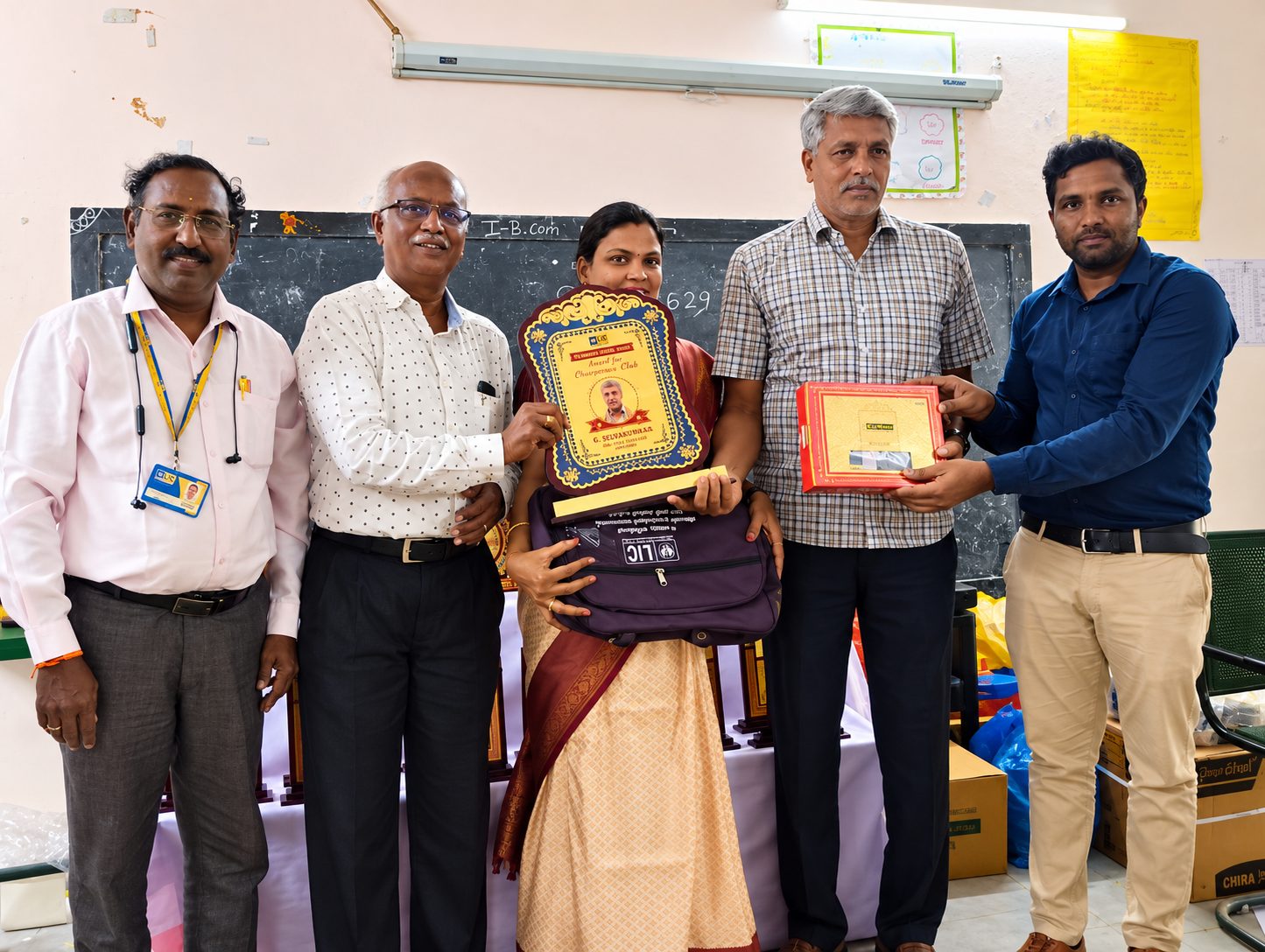 G. Selvakumar with the Chairman's Club award plaque and officials