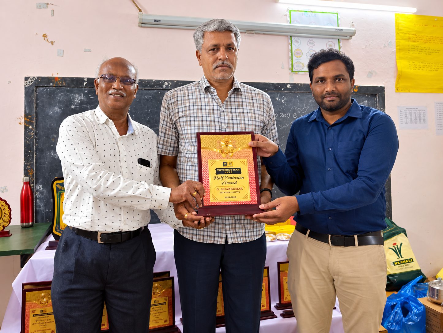 G. Selvakumar receiving the Centurion Award plaque for 2024-25